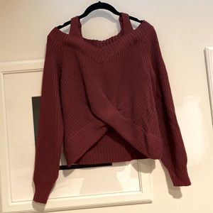 Burgundy sweater with cutout shoulders and front twist